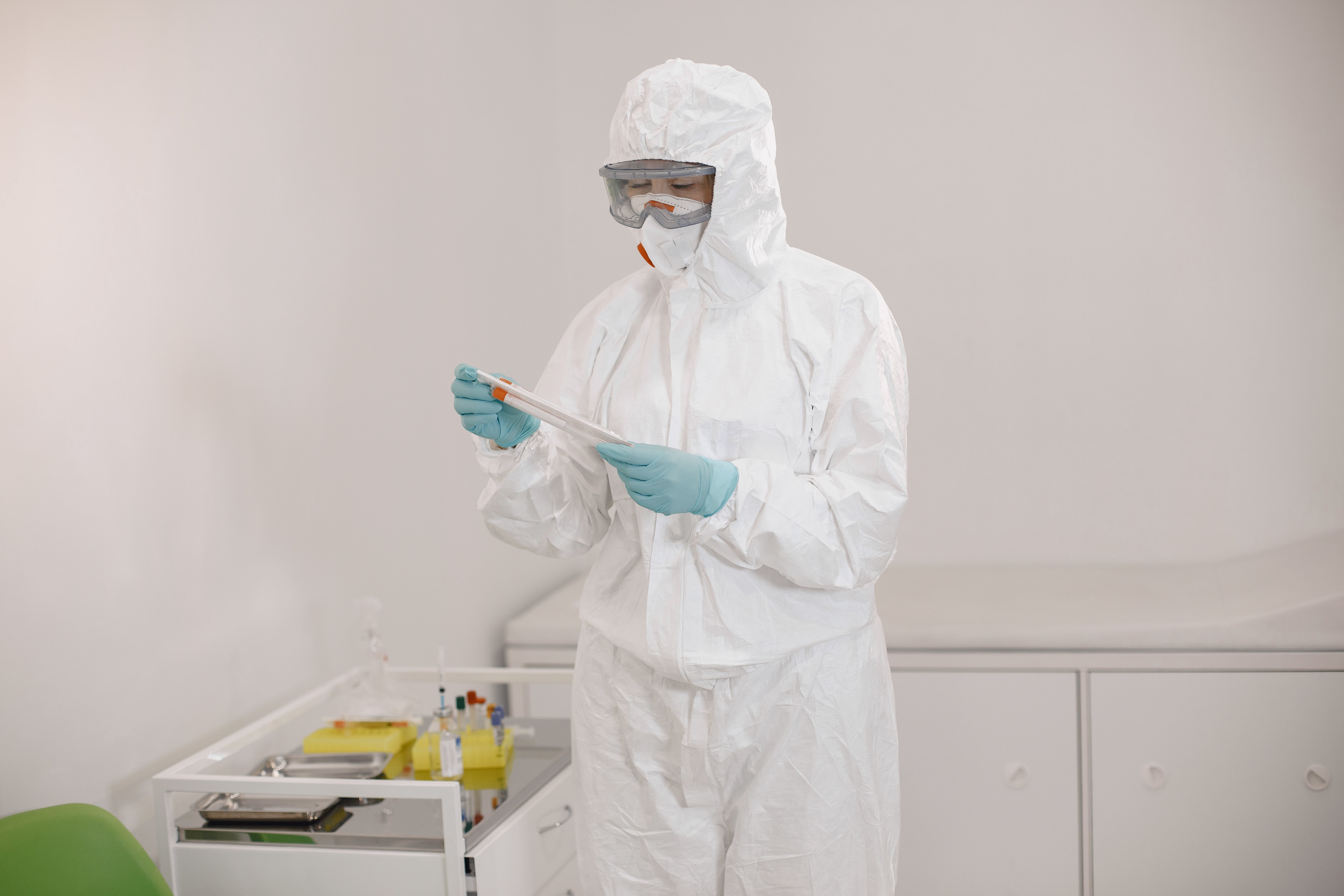 A woman working at a hospital testing for infections and diseases that could have been prevented through the use of body bags